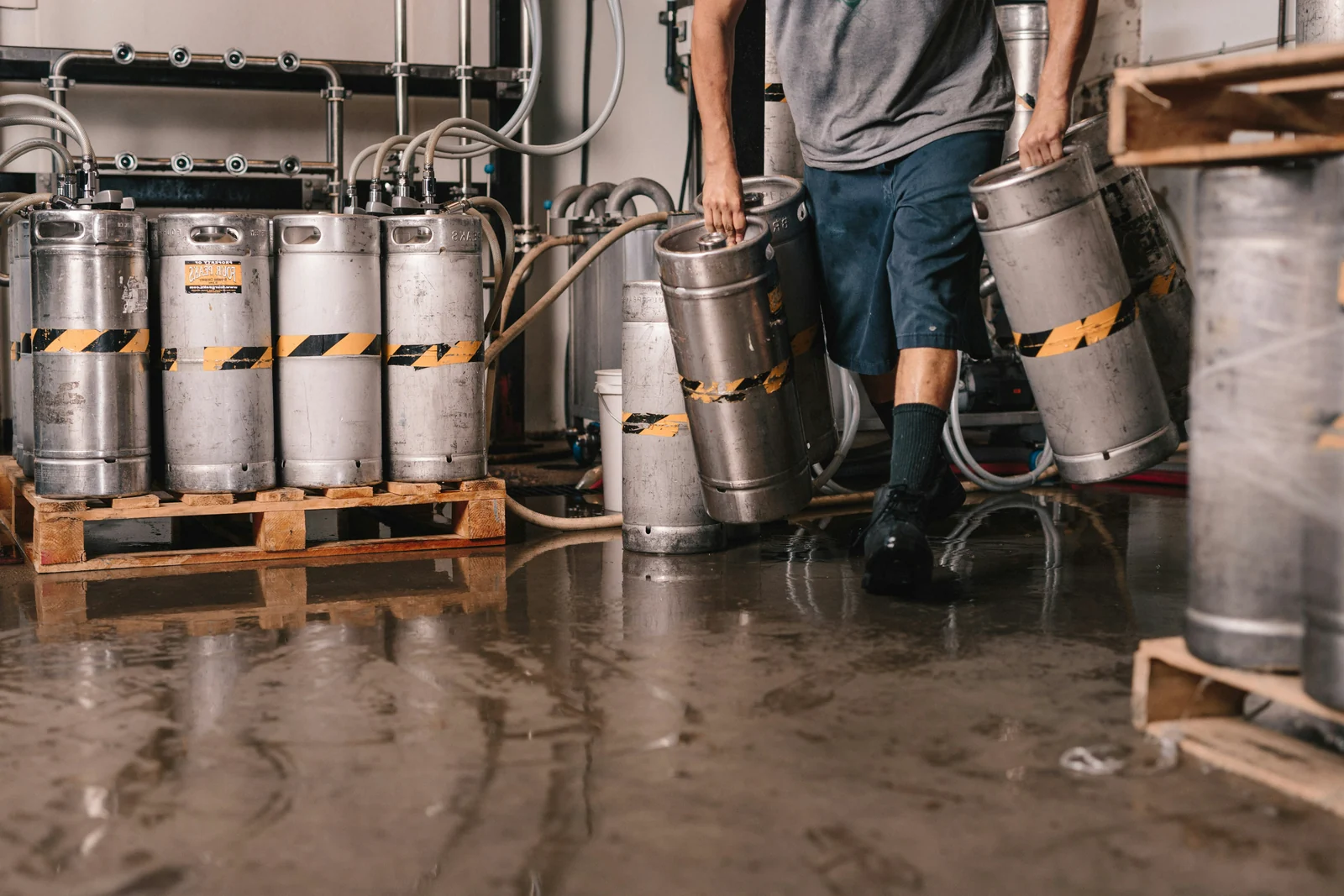 Kegs being moved in a brewery warehouse