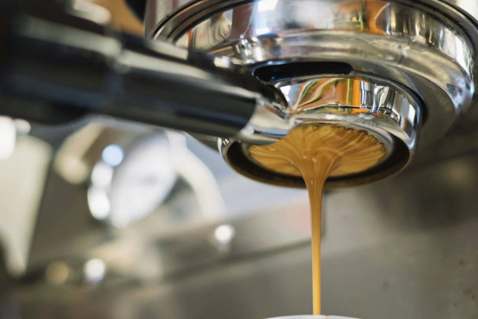 Coffee being poured from an espresso machine
